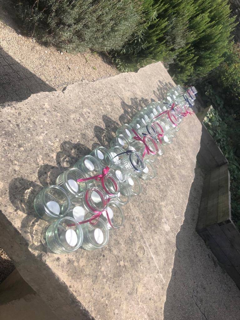 a group of empty water bottles sitting on top of a rock.