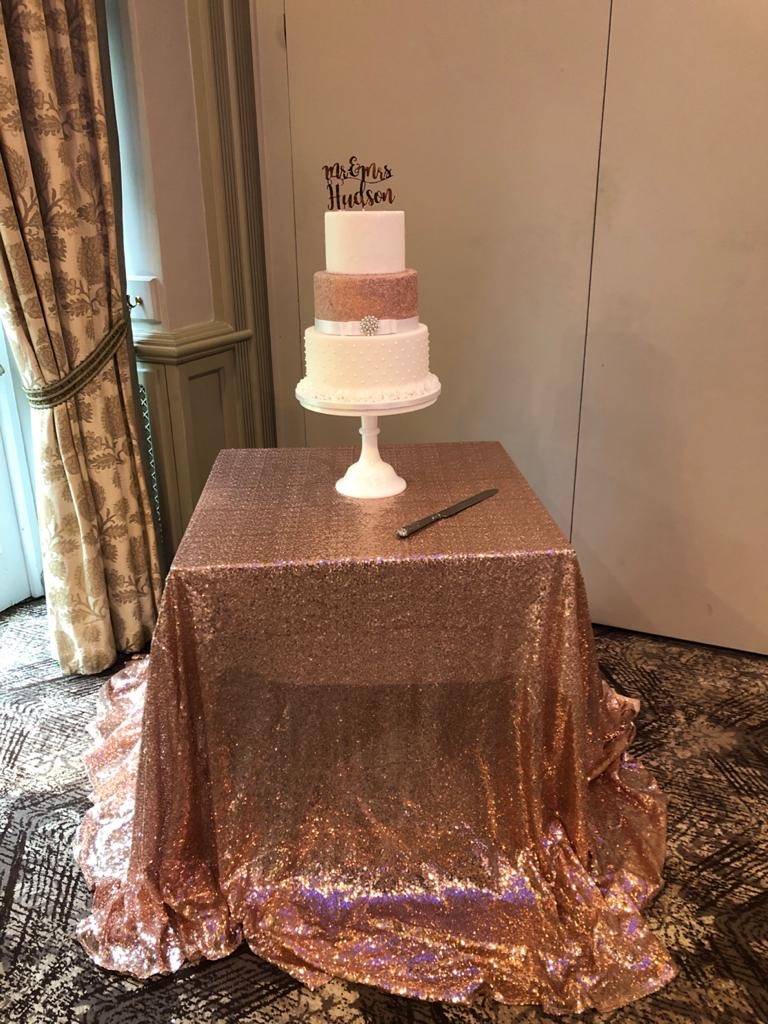 a table with a cake on top of it.