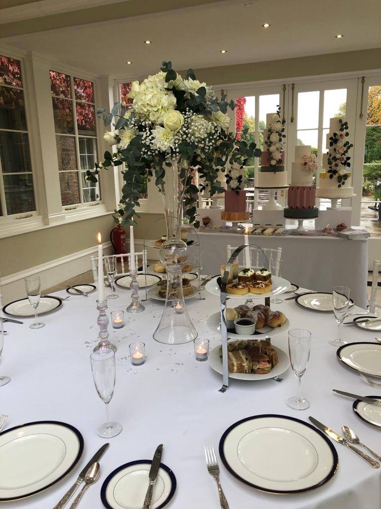 a table set up with plates and silverware.