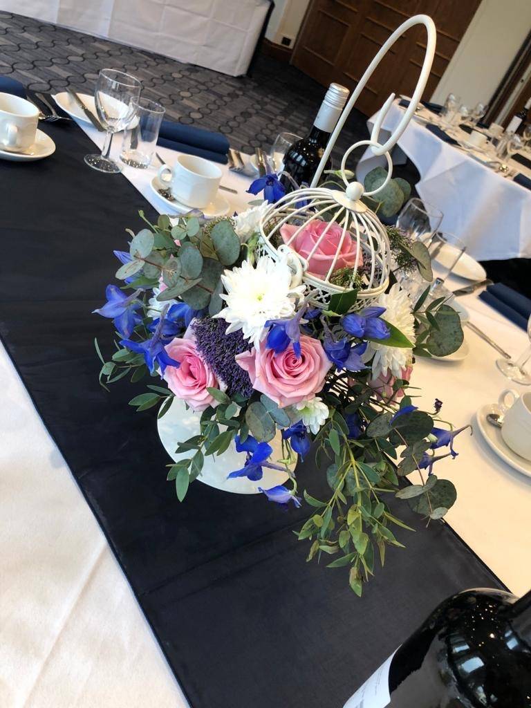 a table with a vase of flowers on it.