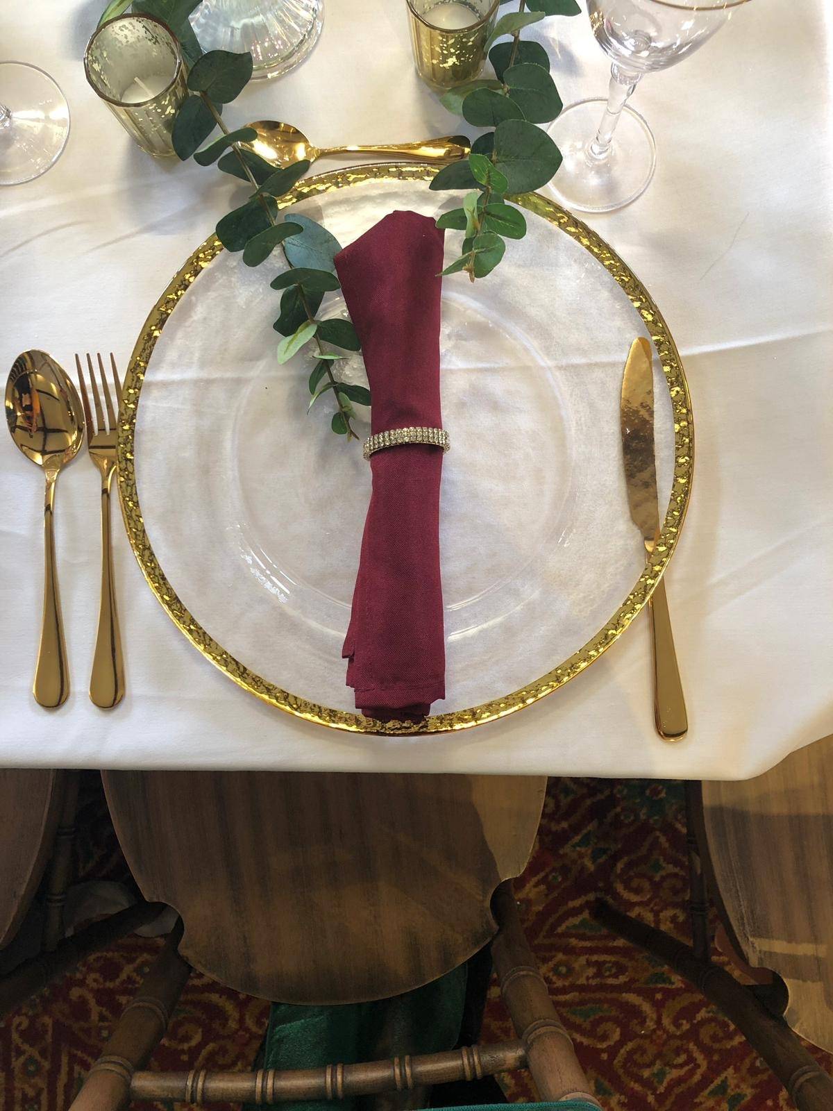 a place setting with a napkin, fork, and knife.