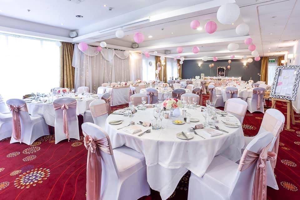 a banquet room set up for a wedding.
