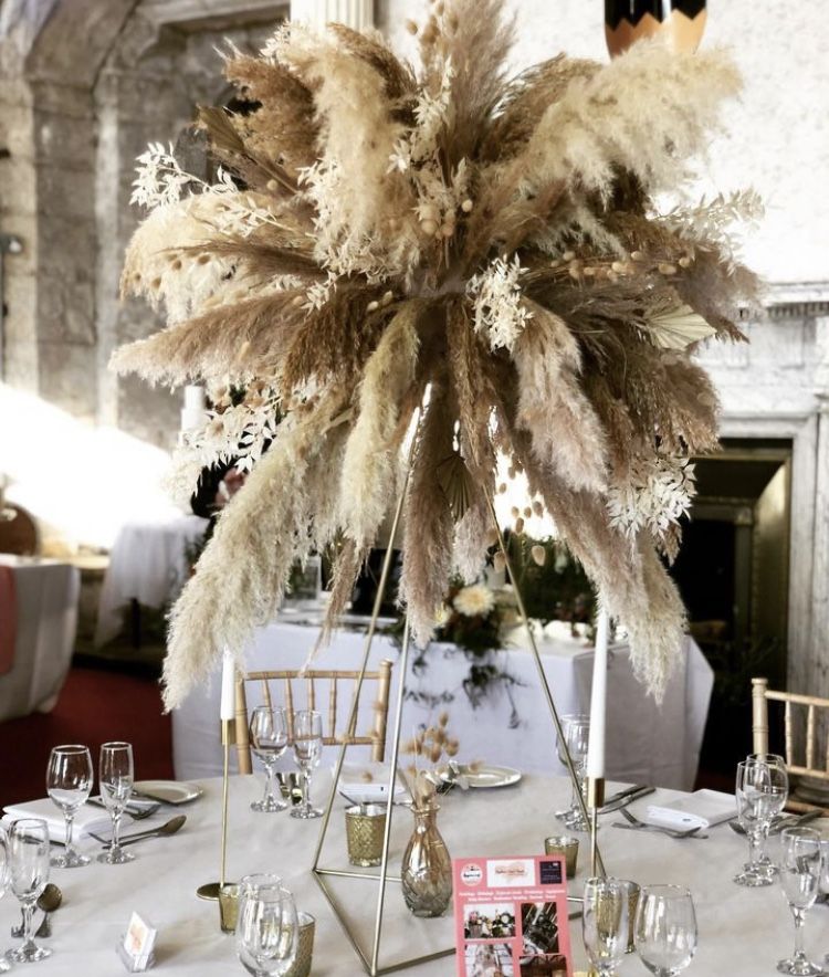 a table with a white table cloth and a centerpiece.