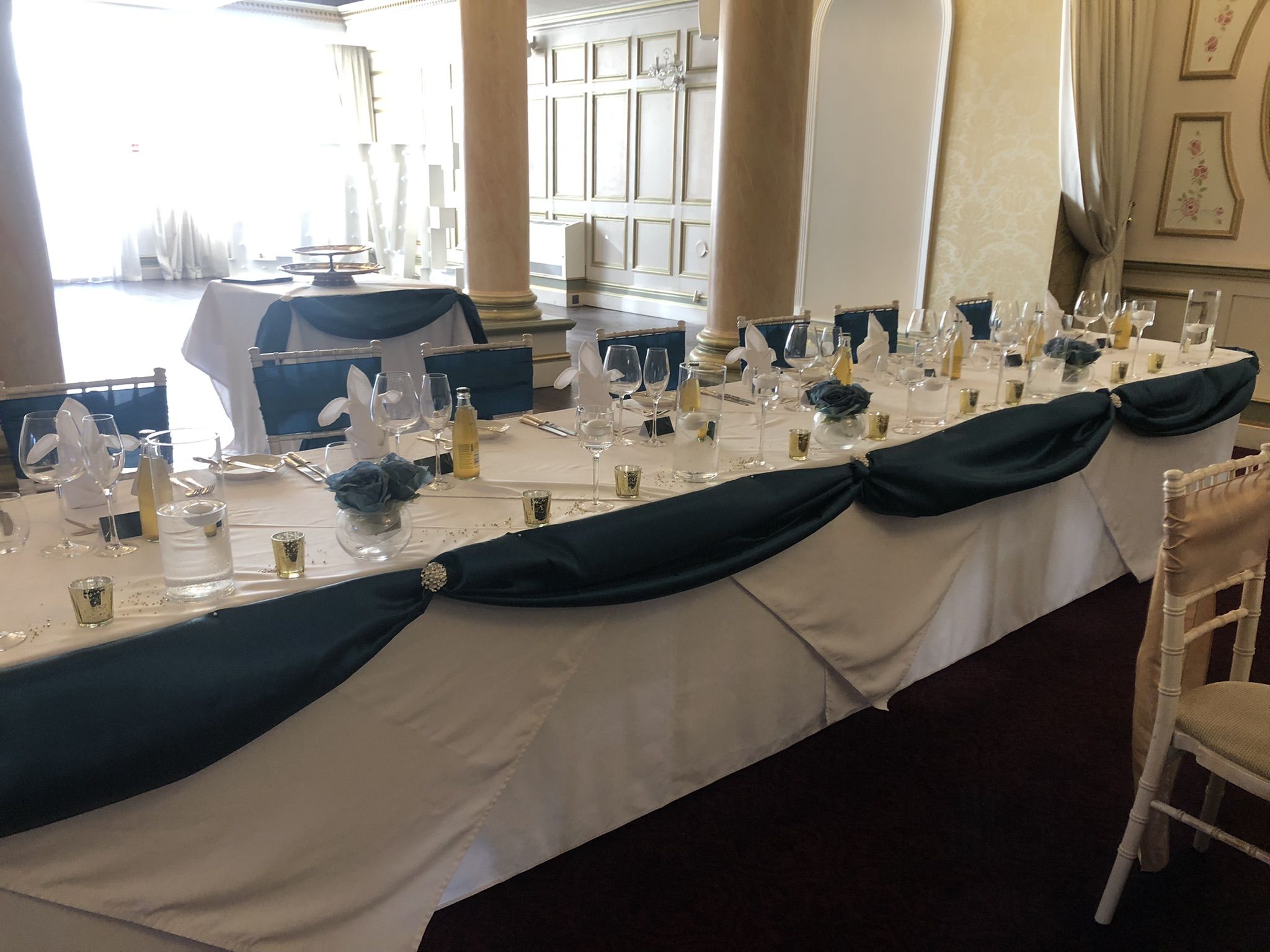 a long table is set up for a formal function.