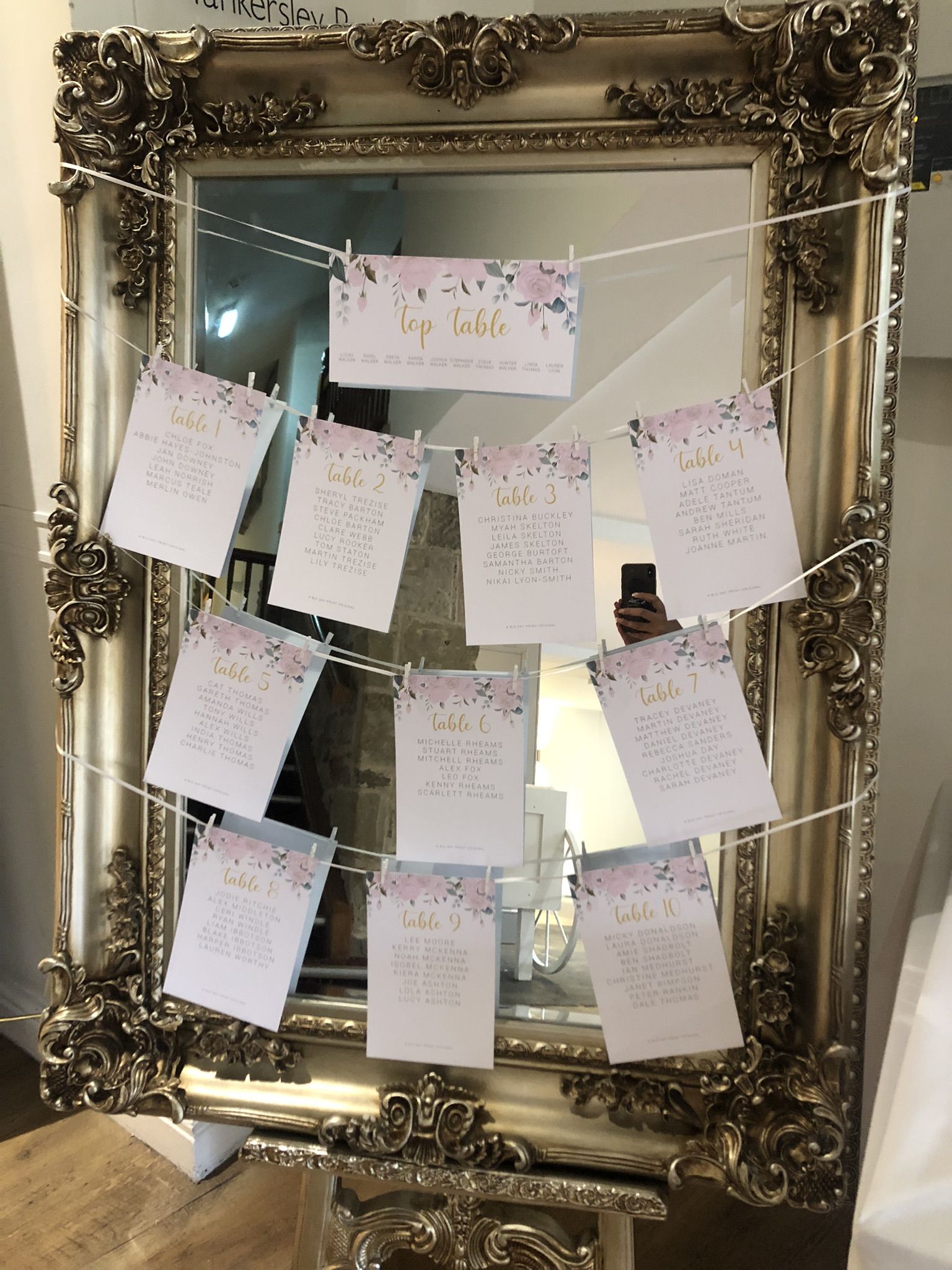 a mirror with a bunch of cards attached to it.