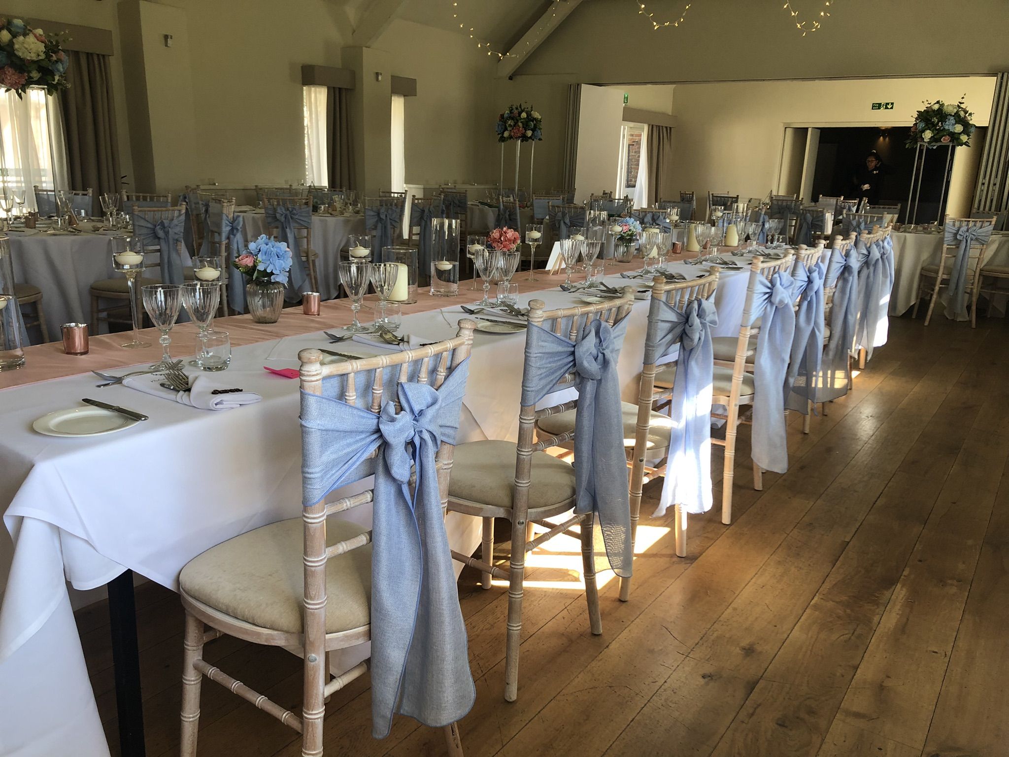 a long table is set up for a formal function.