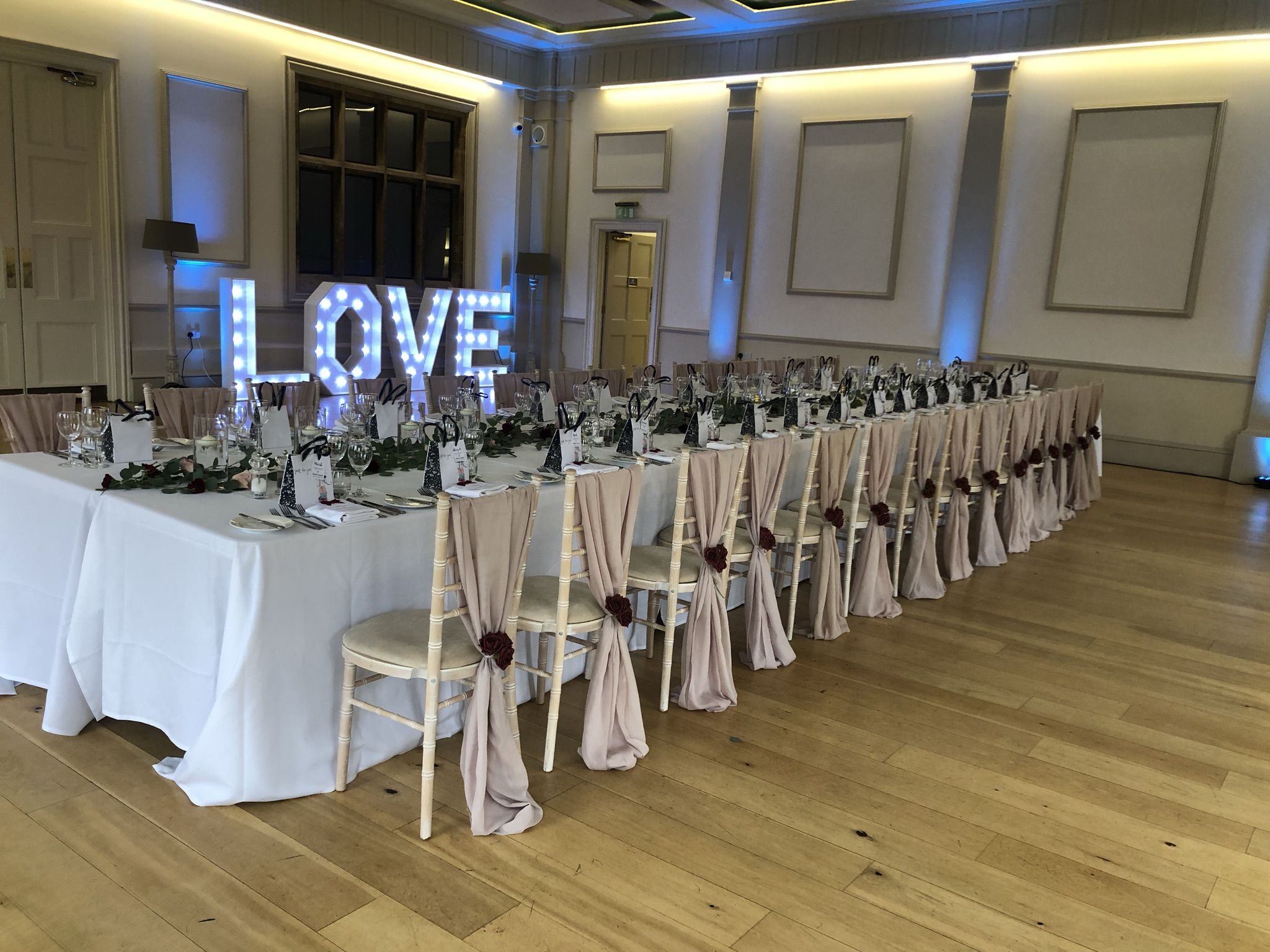 a long table set up for a wedding reception.