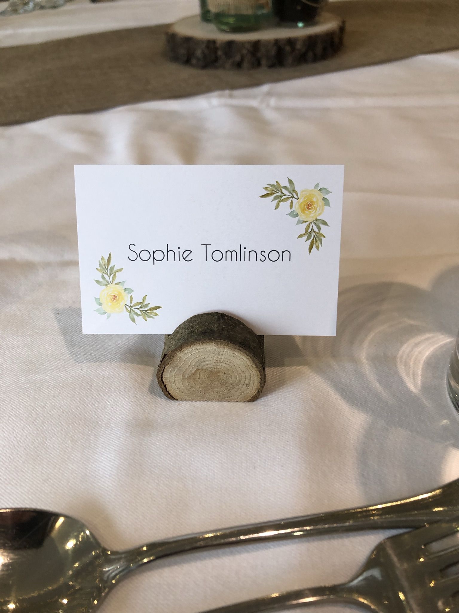 a place setting with a place card and silverware.