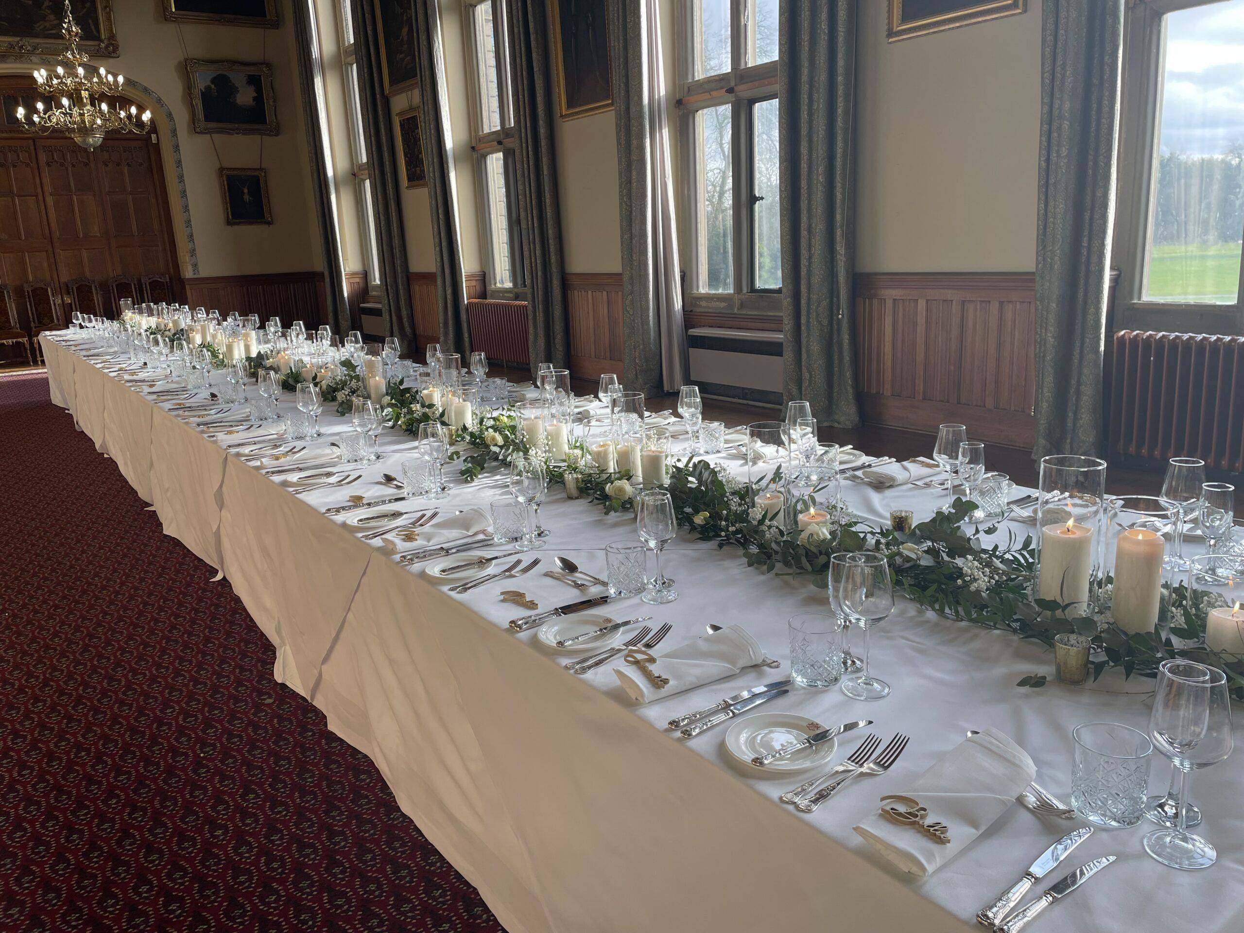 a long table is set for a formal dinner.