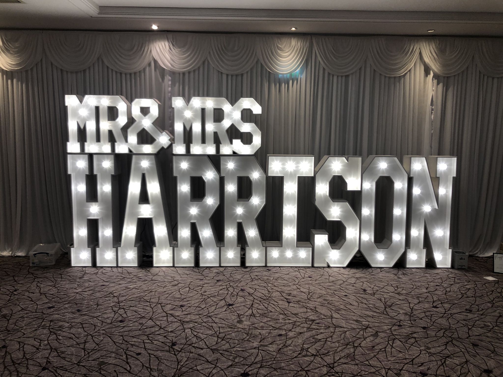 a large marquee sign that says mr and mrs harrison.