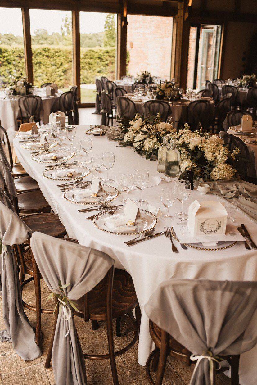 a long table is set with place settings and place settings.