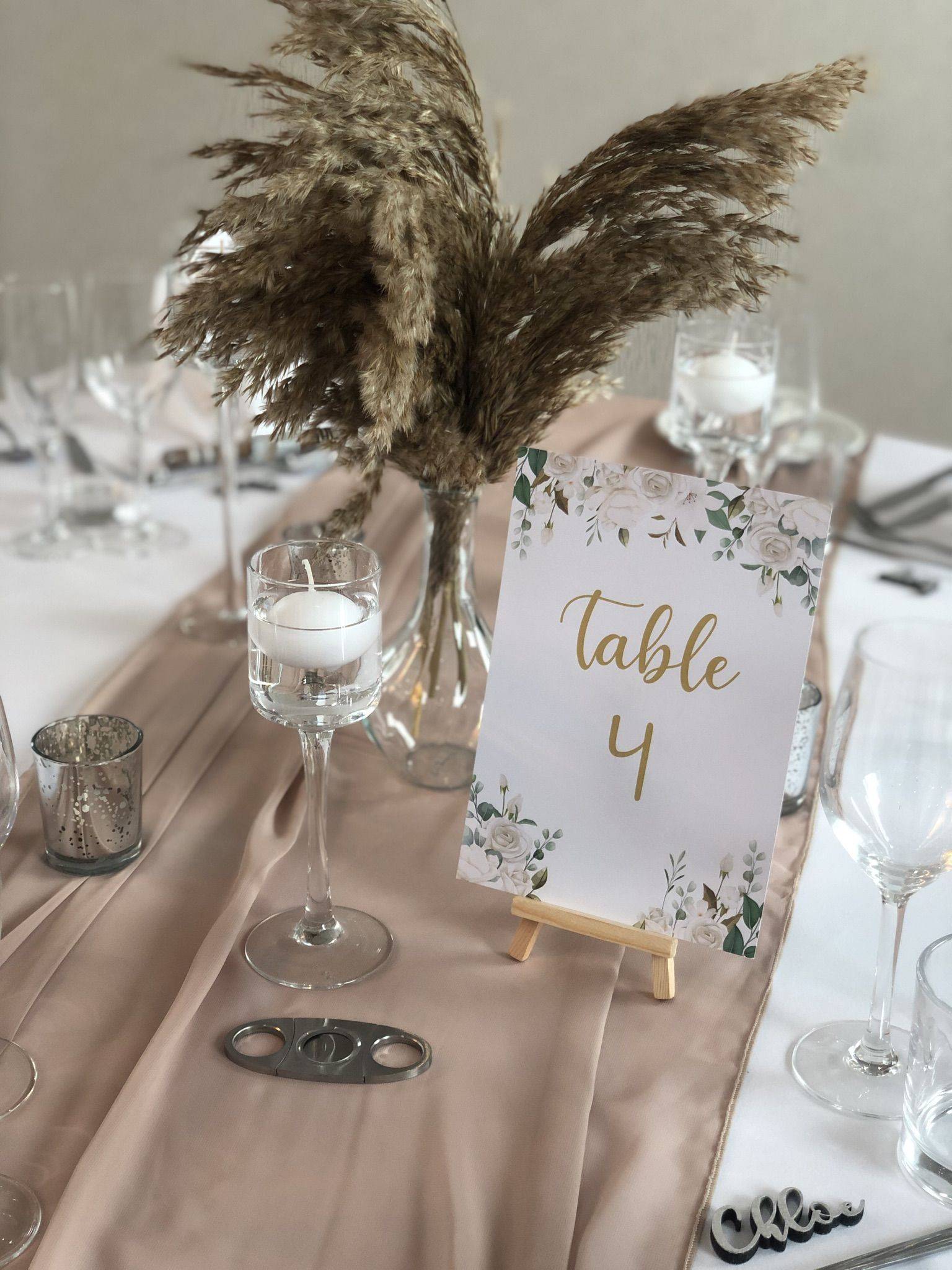 a table is set with a table number and place cards.