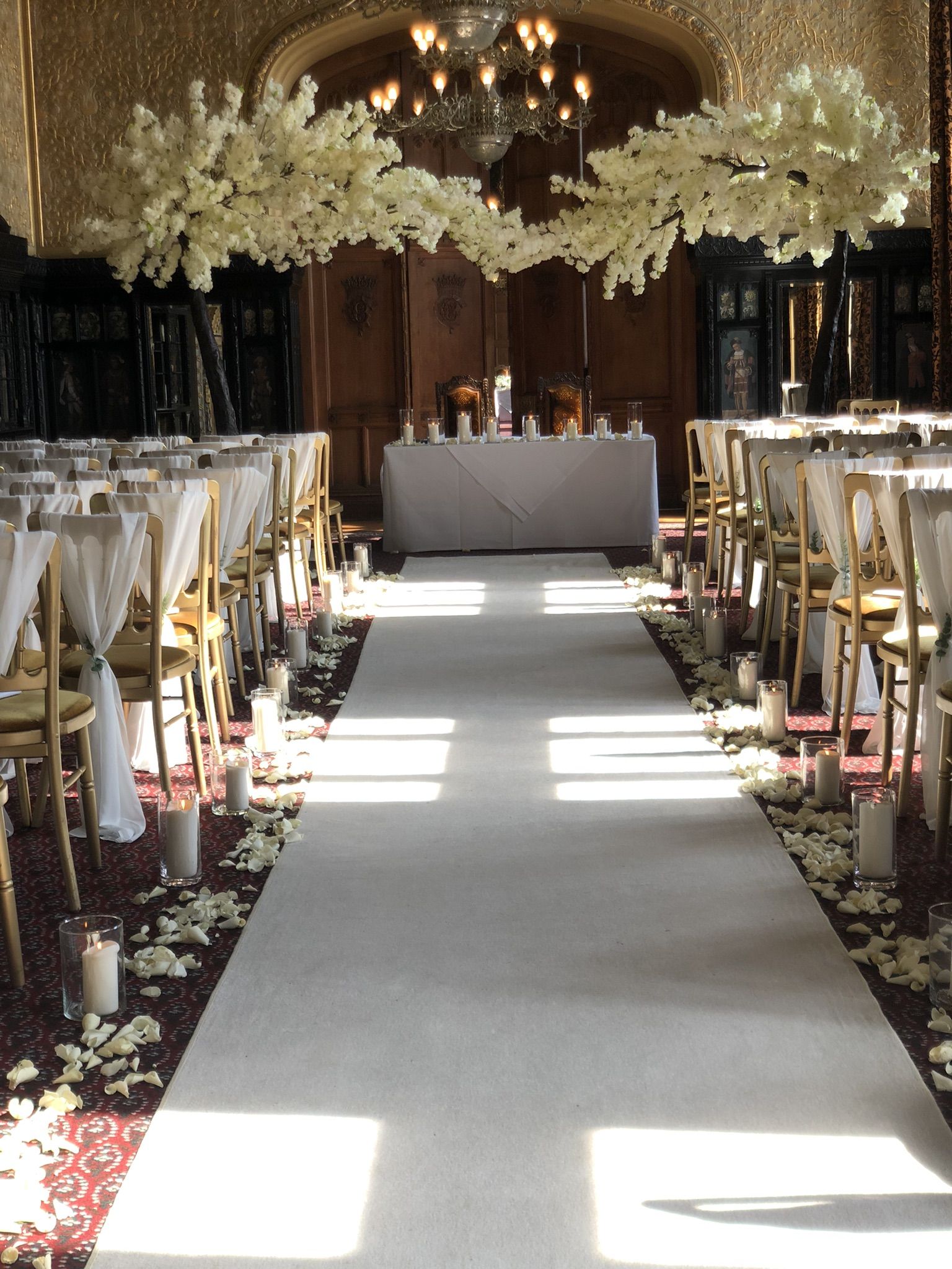 a long aisle lined with tables and chairs.