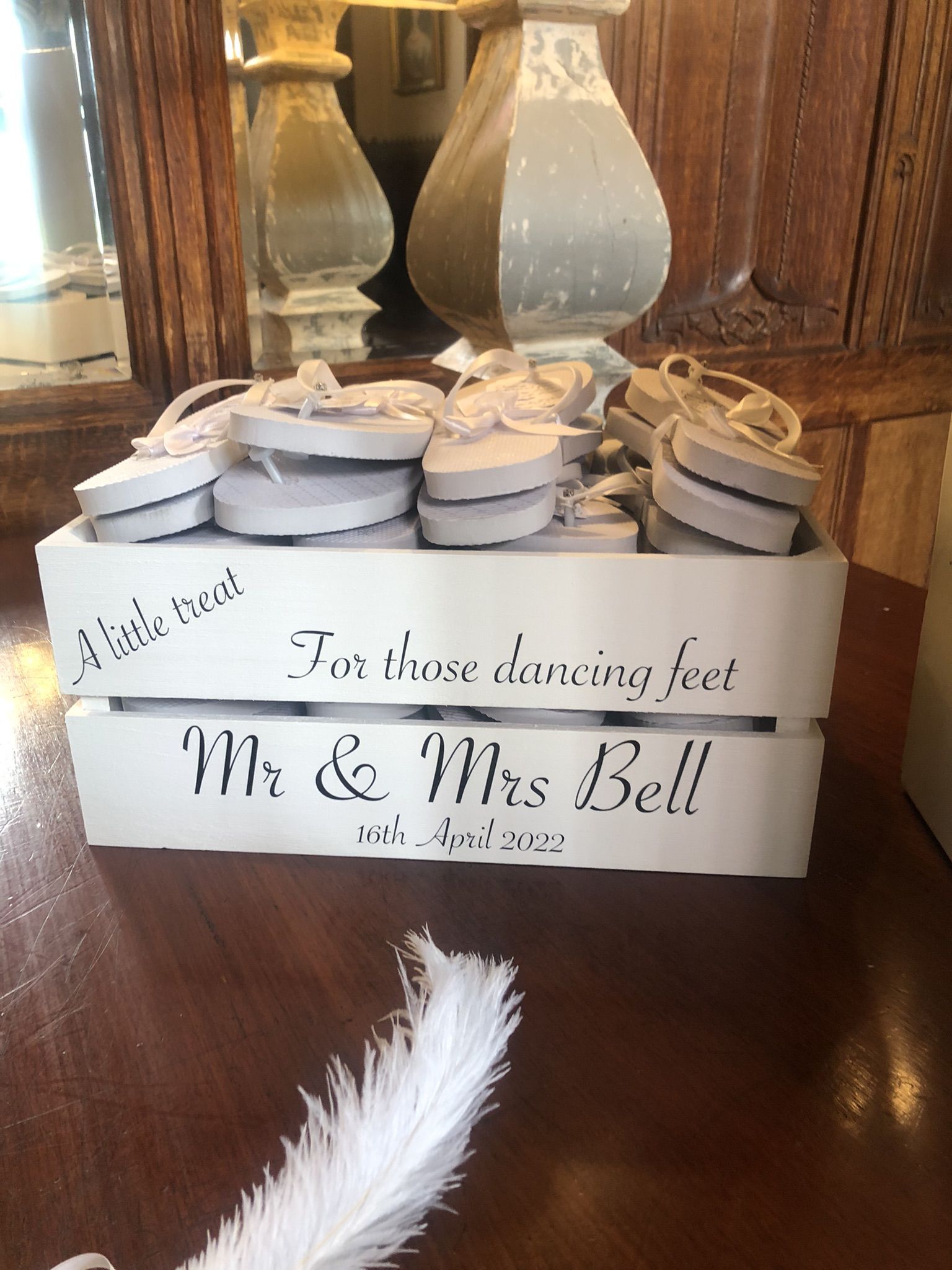 a wooden box with a sign that says to those dancing feet mr and mrs bell.