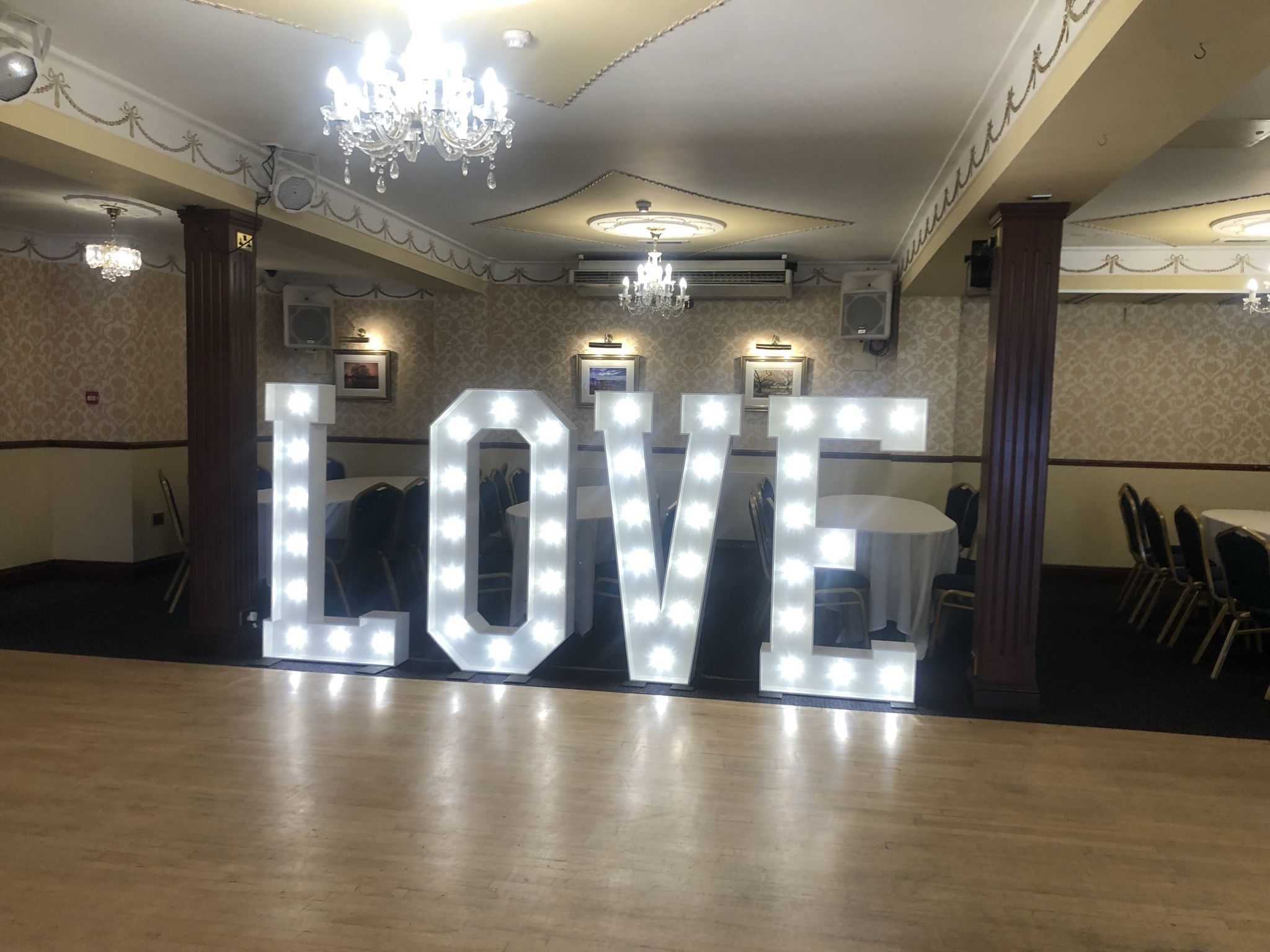 a large lighted love sign in a room.