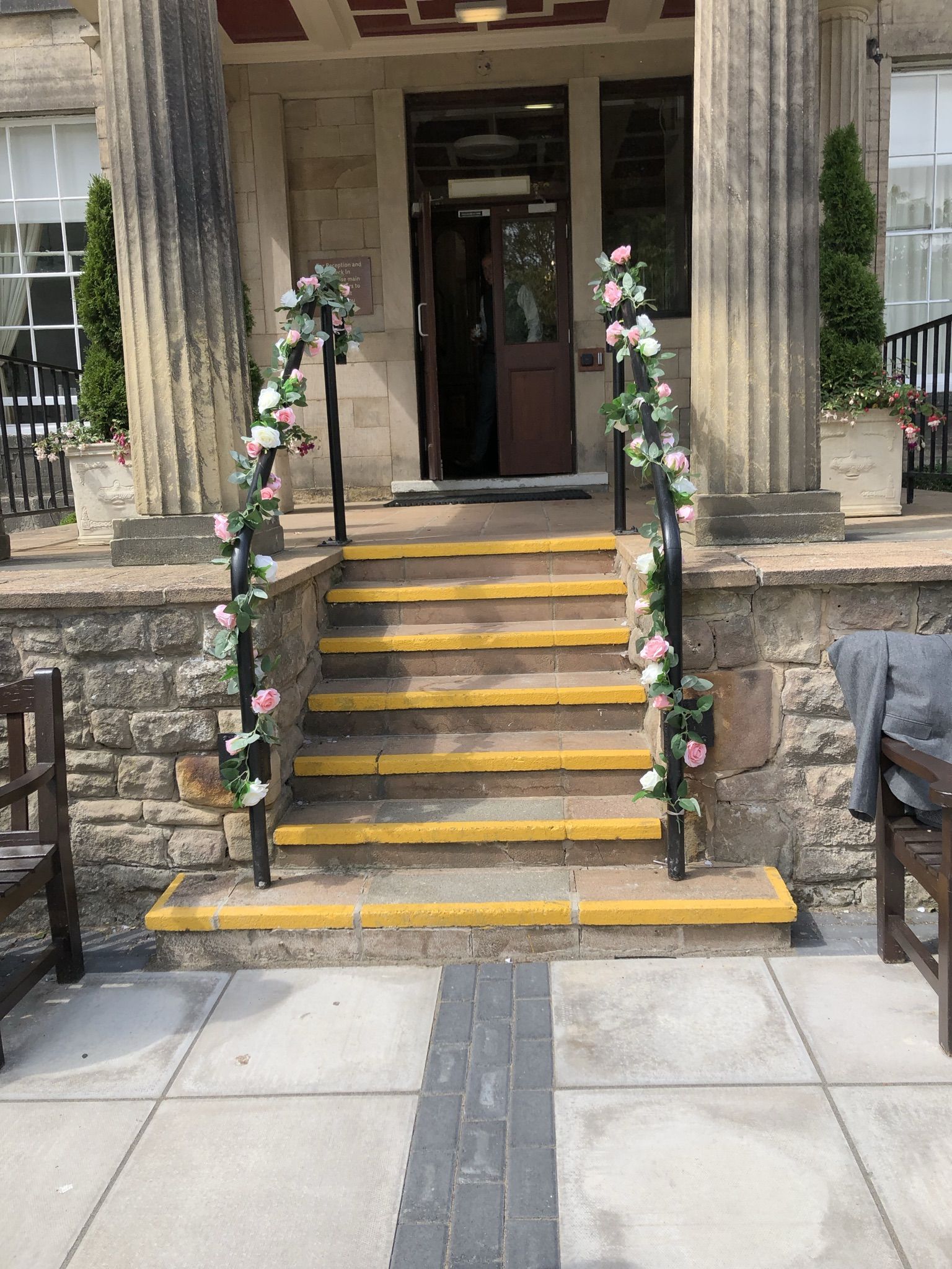 a set of stairs with flowers on them.